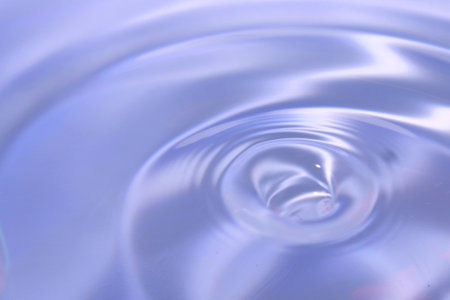 Beautiful blue background in the form of circles on the water. Universal abstract blurred backgroundの写真素材