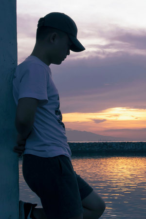 person watching sunsetの写真素材