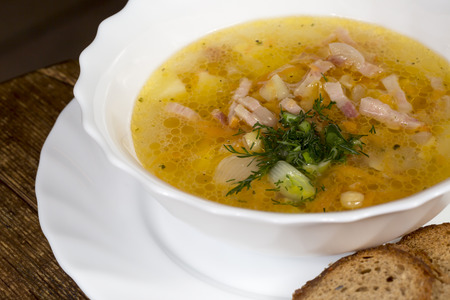 Close up hot soup with meat and toastの写真素材