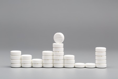 Abstract chart of white pills on a gray backgroundの写真素材