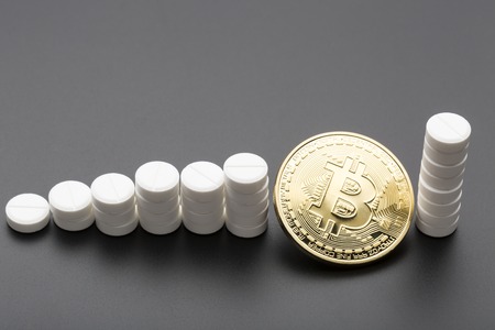 The cryptocurrency bitcoin as a payment option for medicines.Over blackの写真素材