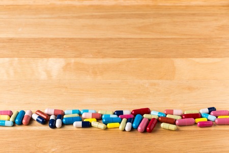 Bottom border from colorful medicine capsulesの写真素材