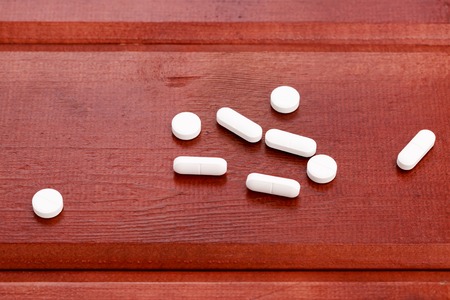 A pile of different white pillsの写真素材
