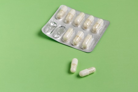 White capsules from foil blister packの写真素材