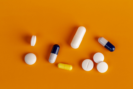 White round pills and color capsulesの写真素材