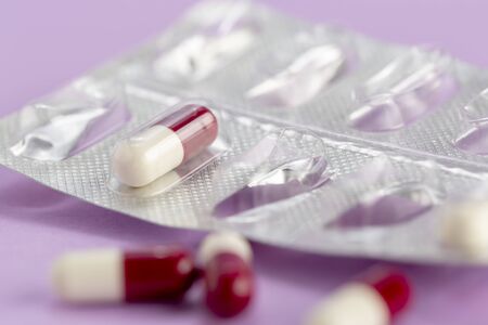 The only capsule of medicine in blister packagingon a colored backgroundの写真素材