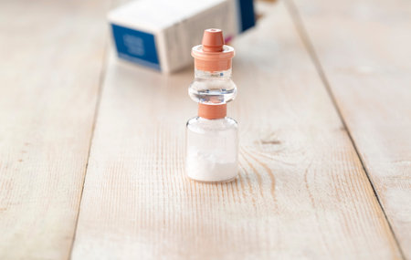 Transparent glass bottle of hydrocortisone. Prepared for injection.