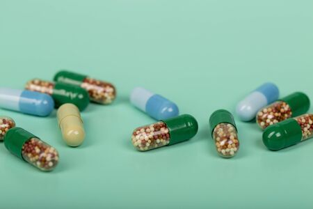 Transparent green capsules with micro granulesの写真素材