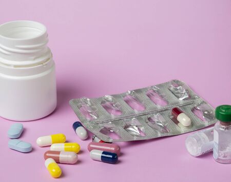 Different of medicine.White plastic pills bottle.Used pills blister packの写真素材