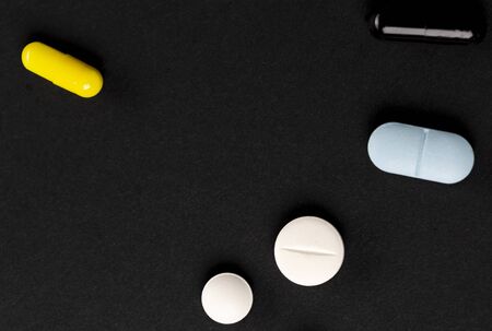 Different medications. Various pill and capsules. One-color backdrop.の写真素材