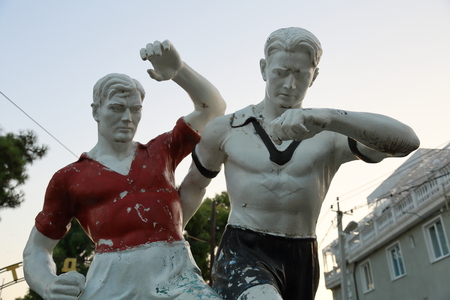 Dynamic monument to two players of white plasterの写真素材