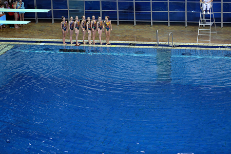 MOSCOW, RUSSIA - APRIL 1, 2016: Women's teams Championship in synchronized swimming at the indoor poolのeditorial素材