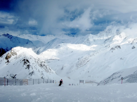 Blinding snow at a ski resort in the Alps mountainsの写真素材