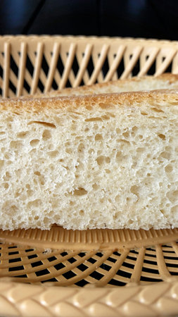 Chunks of fresh white bread on a plastic plate