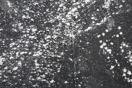 Blots and stains of white paint on ruberoidの写真素材