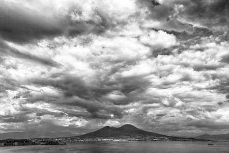 View of a mountain landscape and the sea horizon under the storm clouds