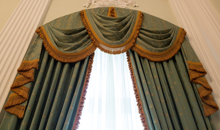 Heavy curtains made of thick fabric. Window decoration ideaの写真素材