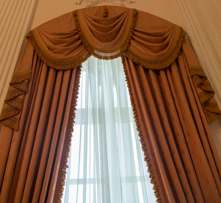 Heavy curtains made of thick fabric. Window decoration ideaの写真素材