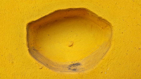 Original textured surface of natural yellow stoneの写真素材