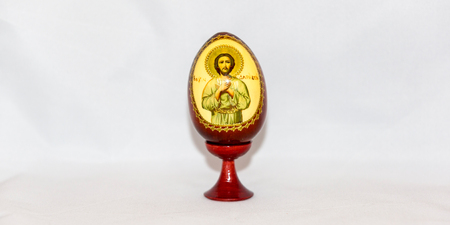 Colorful festive easter egg on white backgroundの写真素材