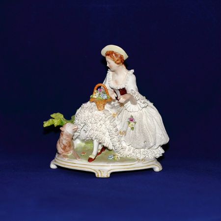 Miniature antique figurine from porcelain of the early 20th centuryの写真素材
