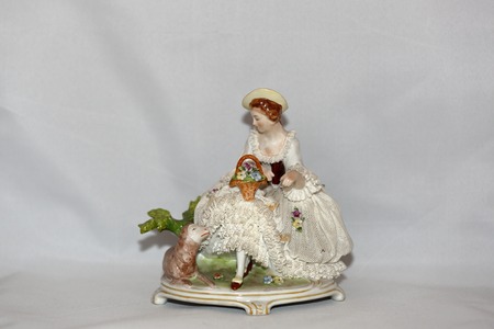 Miniature antique figurine from porcelain of the early 20th centuryの写真素材