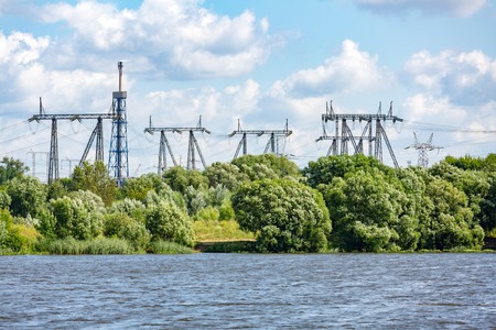 Huge metal racks of high voltage power lines in the cityscapeの写真素材