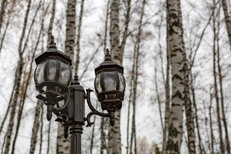 Vintage black lantern on a city streetの写真素材