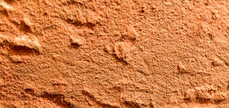 Original textured surface of of a natural coarse stoneの写真素材