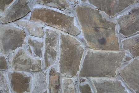 Original textured surface of of a natural coarse stoneの写真素材