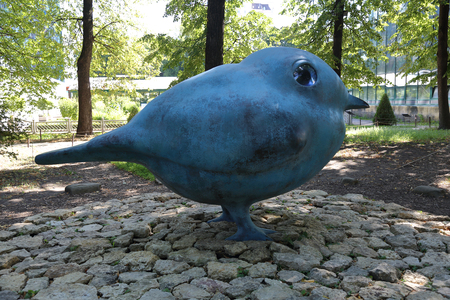 MOSCOW, RUSSIA - AUGUST 10, 2018: Blue sculpture similar to Twitter Bird in the botanical garden "Aptekarskiy Ogorod"のeditorial素材
