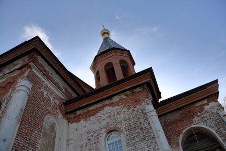 KARELIA, RUSSIA - OCTOBER 14, 2018: Brick single-altar single-headed Church of the Life-Giving Trinity with a bell tower in Konchezero. Founded in the 19th centuryのeditorial素材