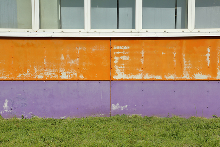 Textured surface of a bright building wallの写真素材