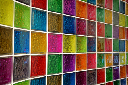 Textured surface of a bright wall of square glass blocksの写真素材
