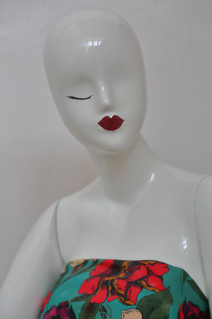 White one-eyed female mannequin of shiny plastic without hairの写真素材