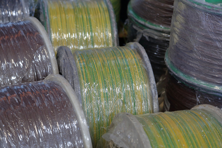 Massive plastic bobbins with wound electric cableの写真素材