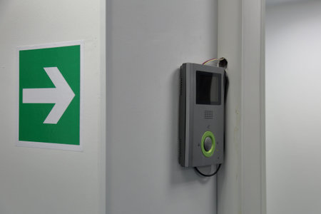 Modern electric door bell on the inner wall of the building