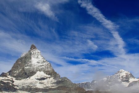 Mount Matterhorn. The height of the peak is 4478 meters. View from the Swiss city of Zermatt on a sunny summer dayの写真素材