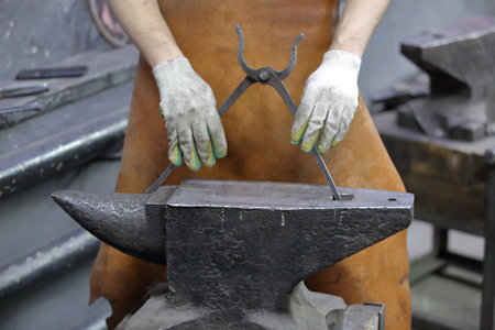 Heavy metal anvil in the forge for forging handmade products