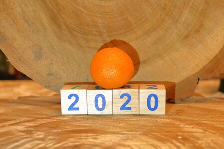Wooden cubes with digits 2020 on a natural wood backgroundの写真素材