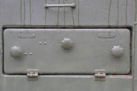 Green textured surface of armored metal with roughness and scratchesの写真素材