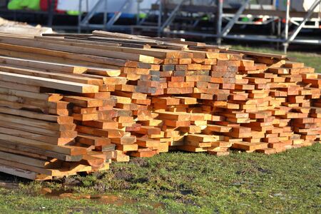 Heap of long wooden boards for the construction and improvement of the yardの写真素材
