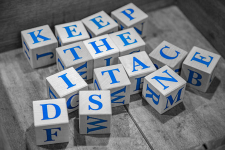 Wooden cubes with lettering Keep the Distance in blue letters