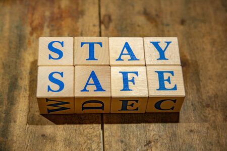 Wooden cubes with lettering Stay Safe in blue lettersの写真素材