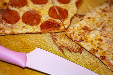 Textured surface of cheese pizza with spices. Homemade fresh baking recipe