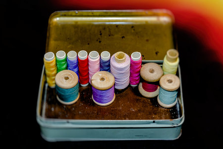 Vintage set of threads for sewing and crafts in an old metal box