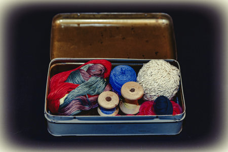Vintage set of threads for sewing and crafts in an old metal box