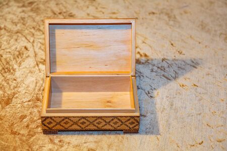 Small elegant retro casket of precious wood for storing valuables and jewelryの写真素材