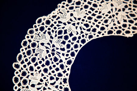 Beautiful textured surface of hand-woven retro lace for garment decoration. The beginning of the...
