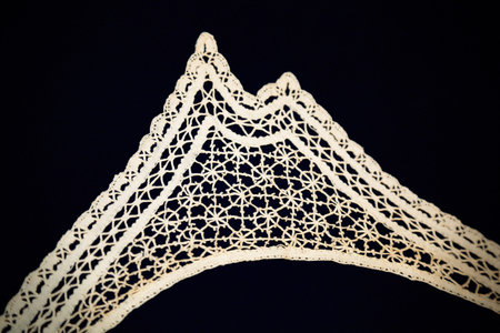 Beautiful textured surface of hand-woven retro lace for garment decoration. The beginning of the...